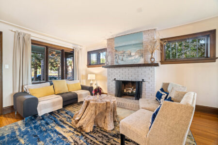 Main living room with fireplace at Bayview Cottage