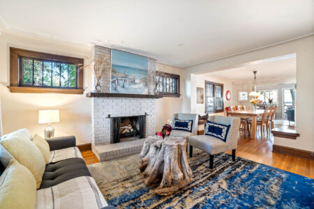 Main living room with fireplace at Bayview Cottage