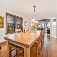Dining area with bay views at Bayview Cottage