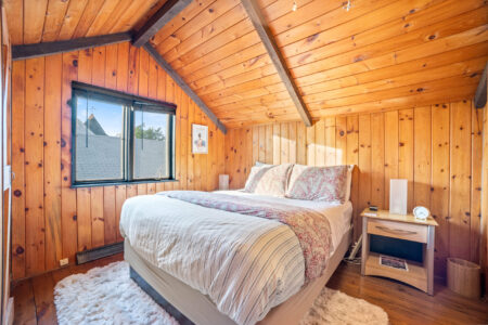 Upstairs queen bedroom with vaulted ceiling