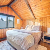 Upstairs queen bedroom with vaulted ceiling