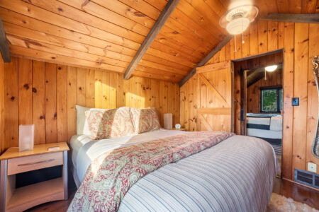 Upstairs queen bedroom with vaulted ceiling